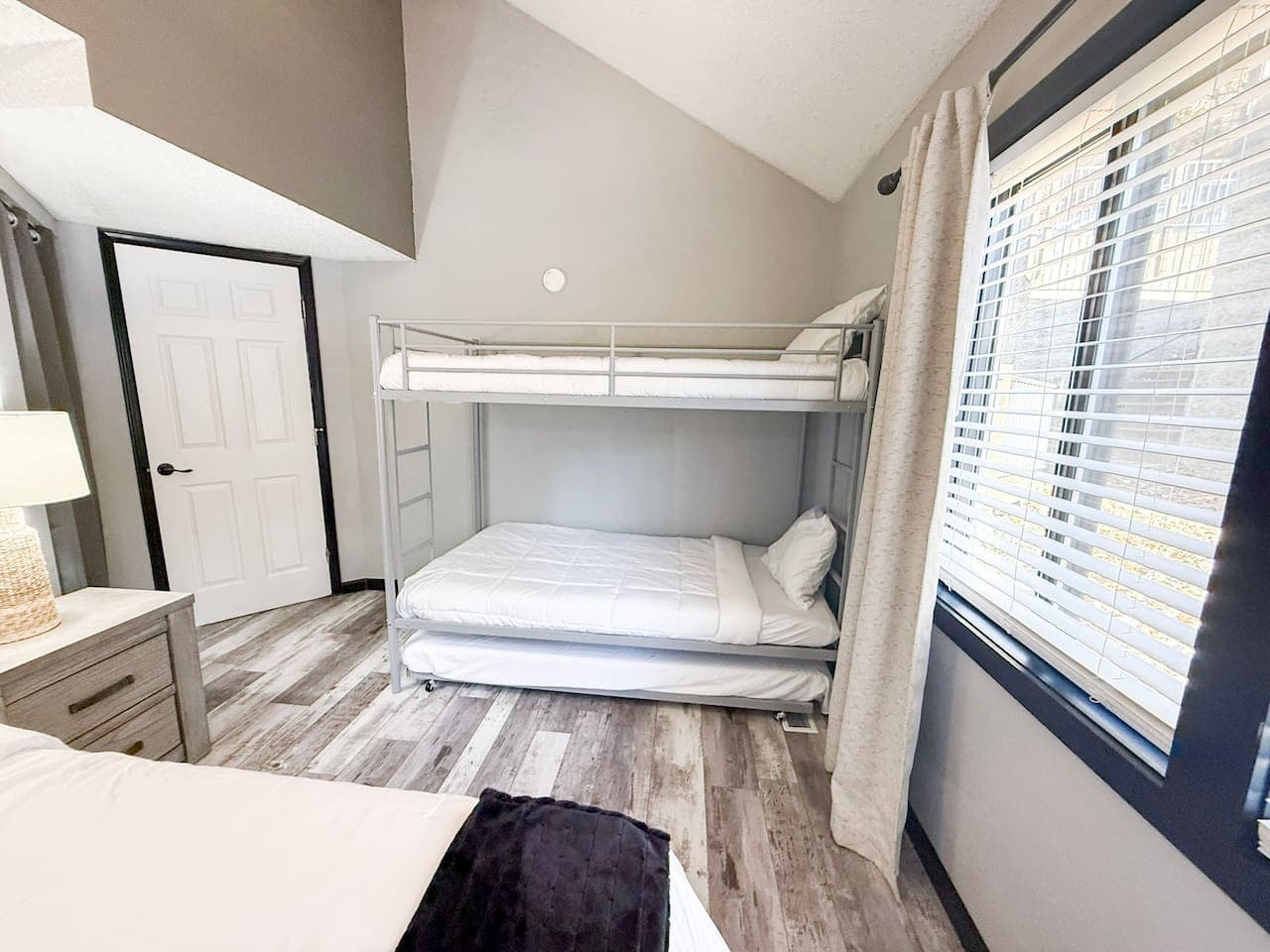 Bright bunk room ideal for kids or extra guests.