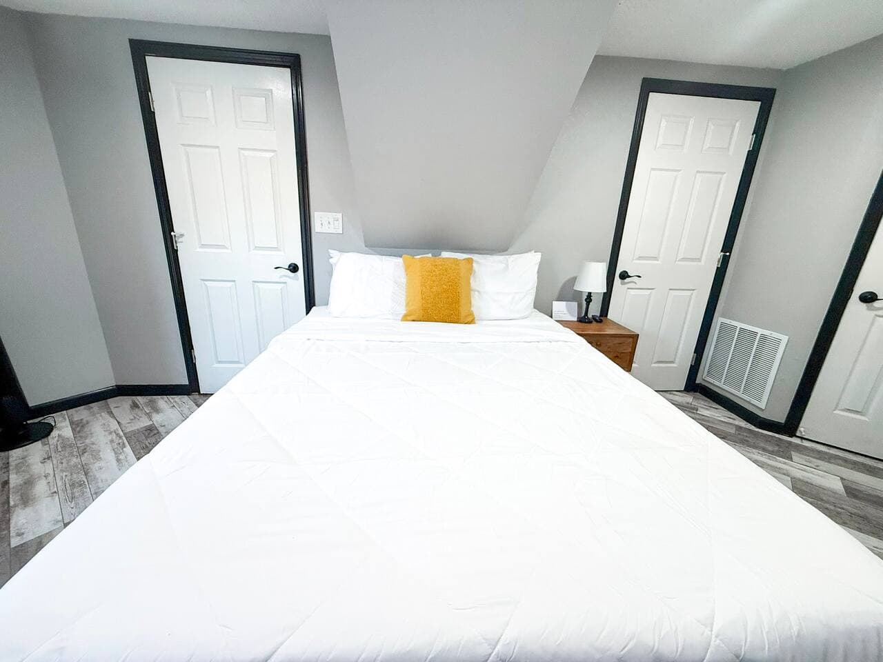 Bright and spacious bedroom with easy bathroom access.