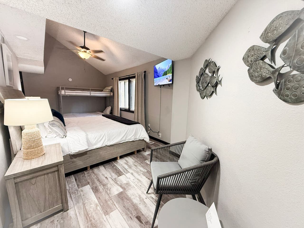 Family-friendly room with king bed and bunk beds.