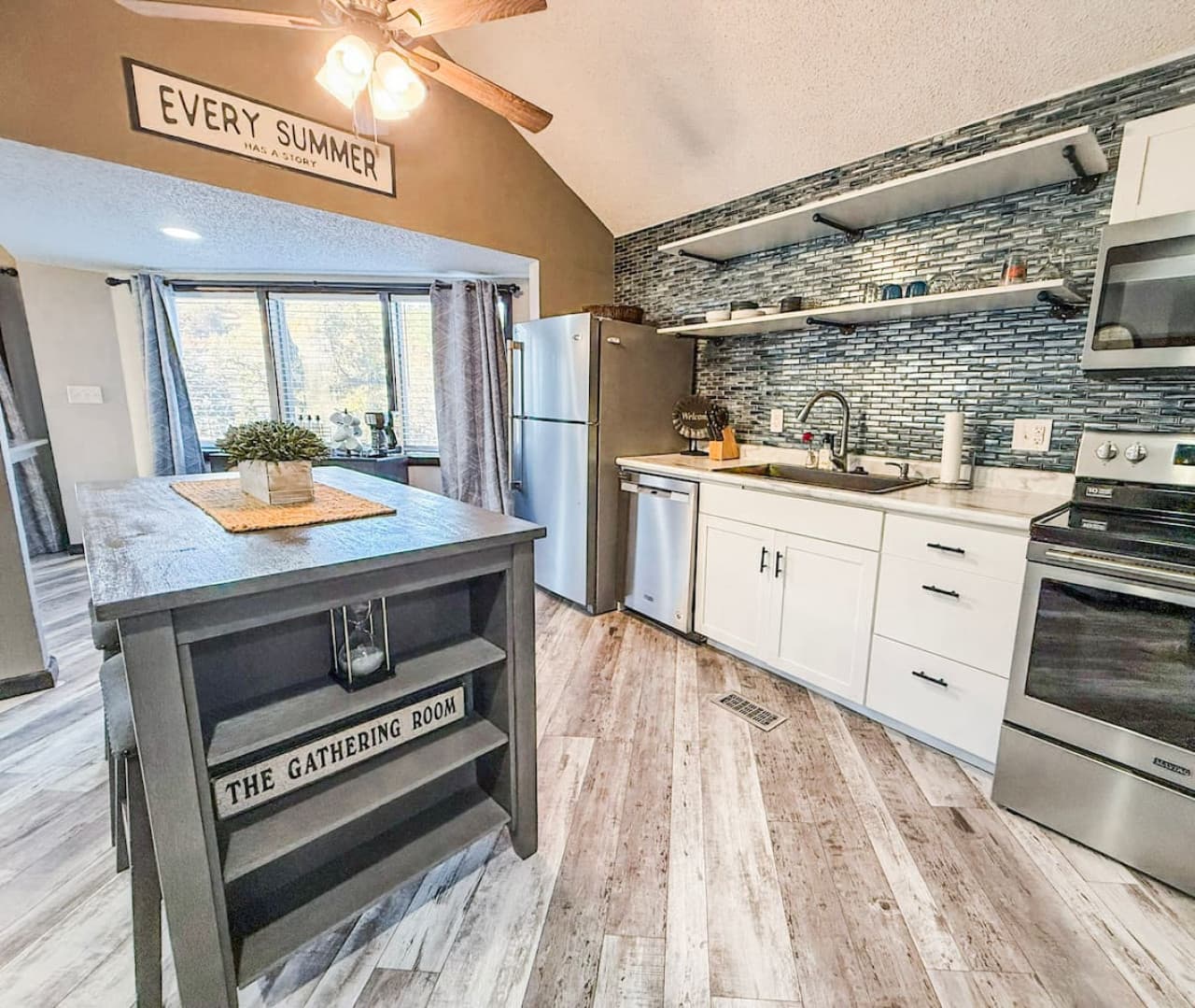 Stylish kitchen with open shelving and a cozy dining nook.