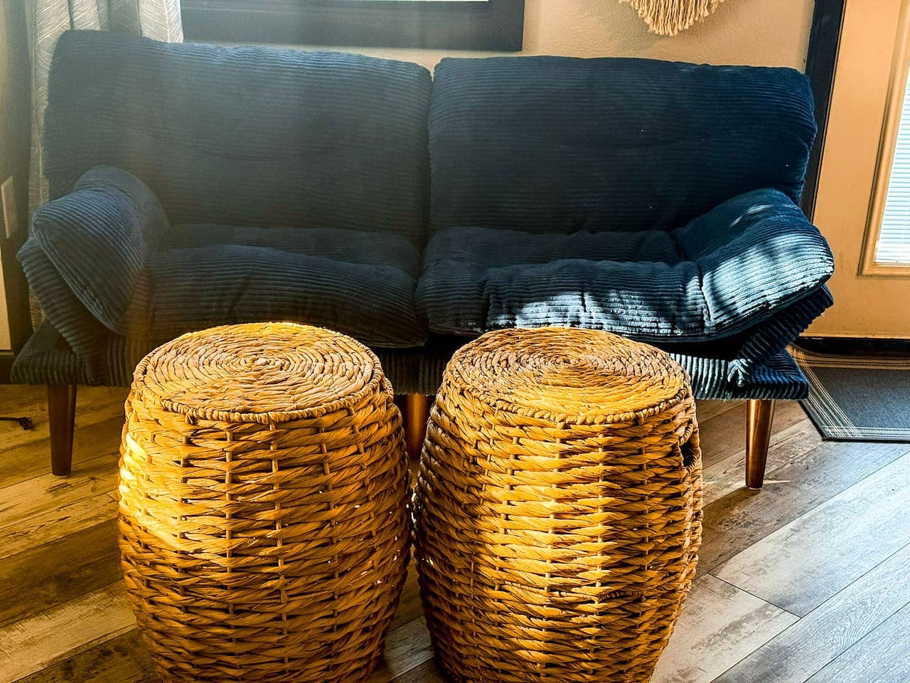 Cozy sitting area with warm natural light and woven accents.