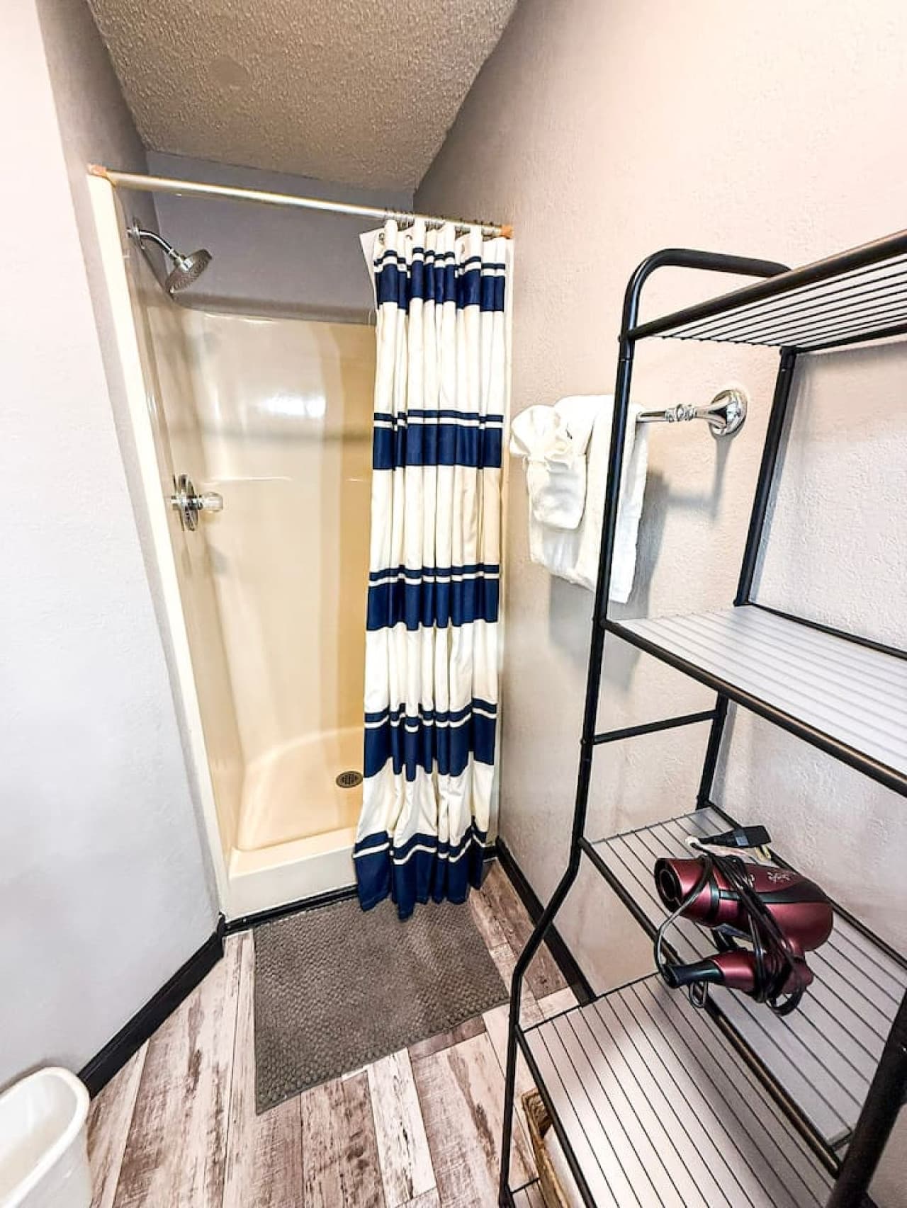 Clean and simple bathroom with walk-in shower.