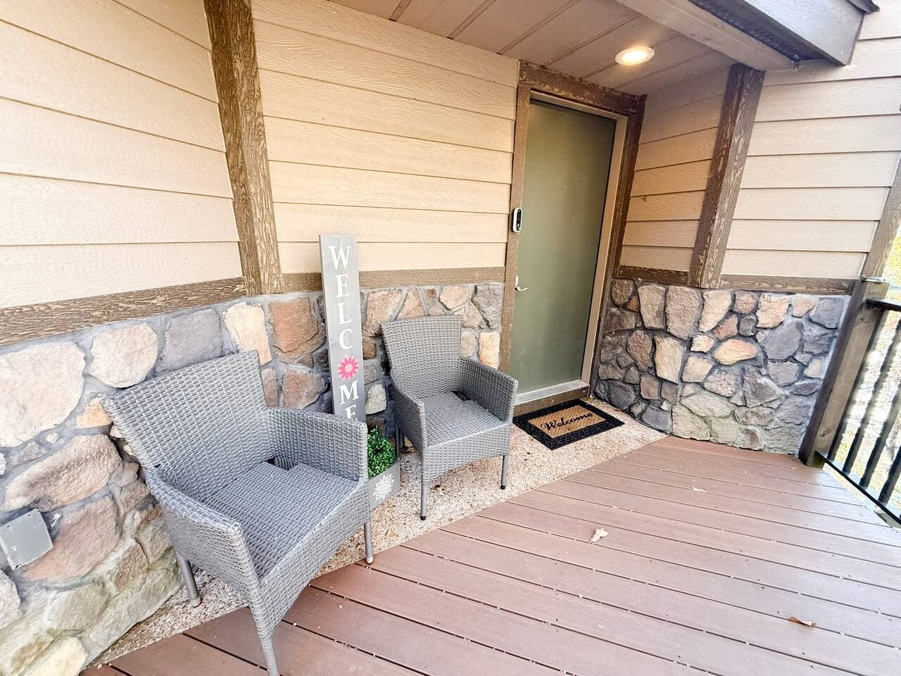 Welcoming front entrance with seating and rustic charm.