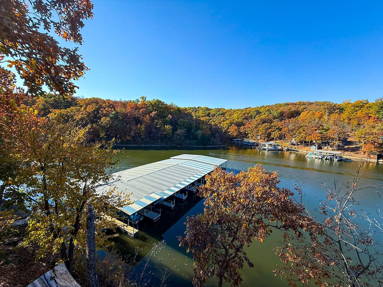 Beautiful view of the covered boat docks and calm waters.