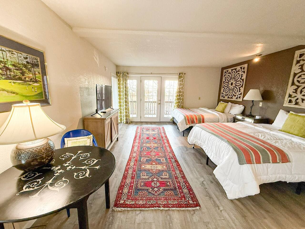 Enjoy a bright, beautifully designed room featuring two comfy beds, chic décor, and direct access to a private patio. Perfect for families or groups seeking comfort, style, and extra space.