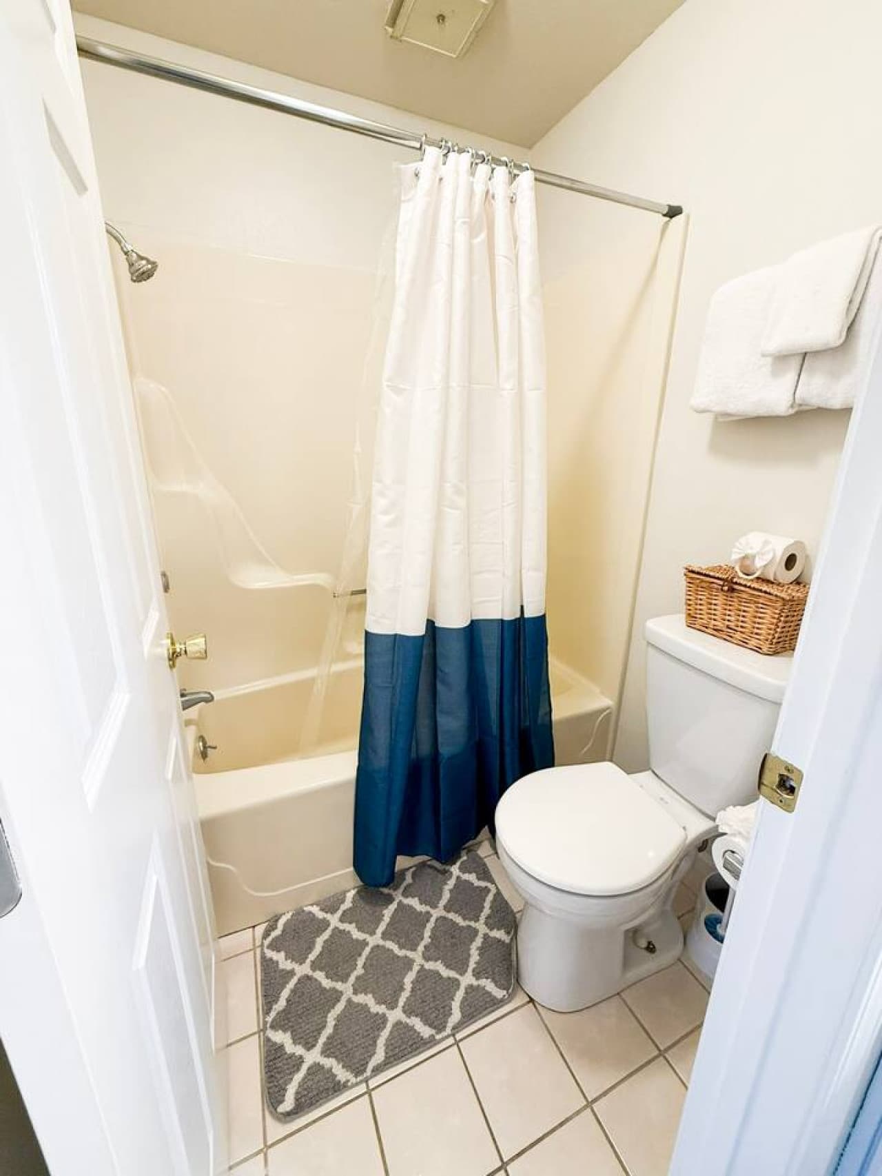 Refresh in a bright, modern bathroom complete with plush towels, a full bathtub, and organized amenities. Designed for guests wanting a clean, comfortable, and stress-free getaway.
