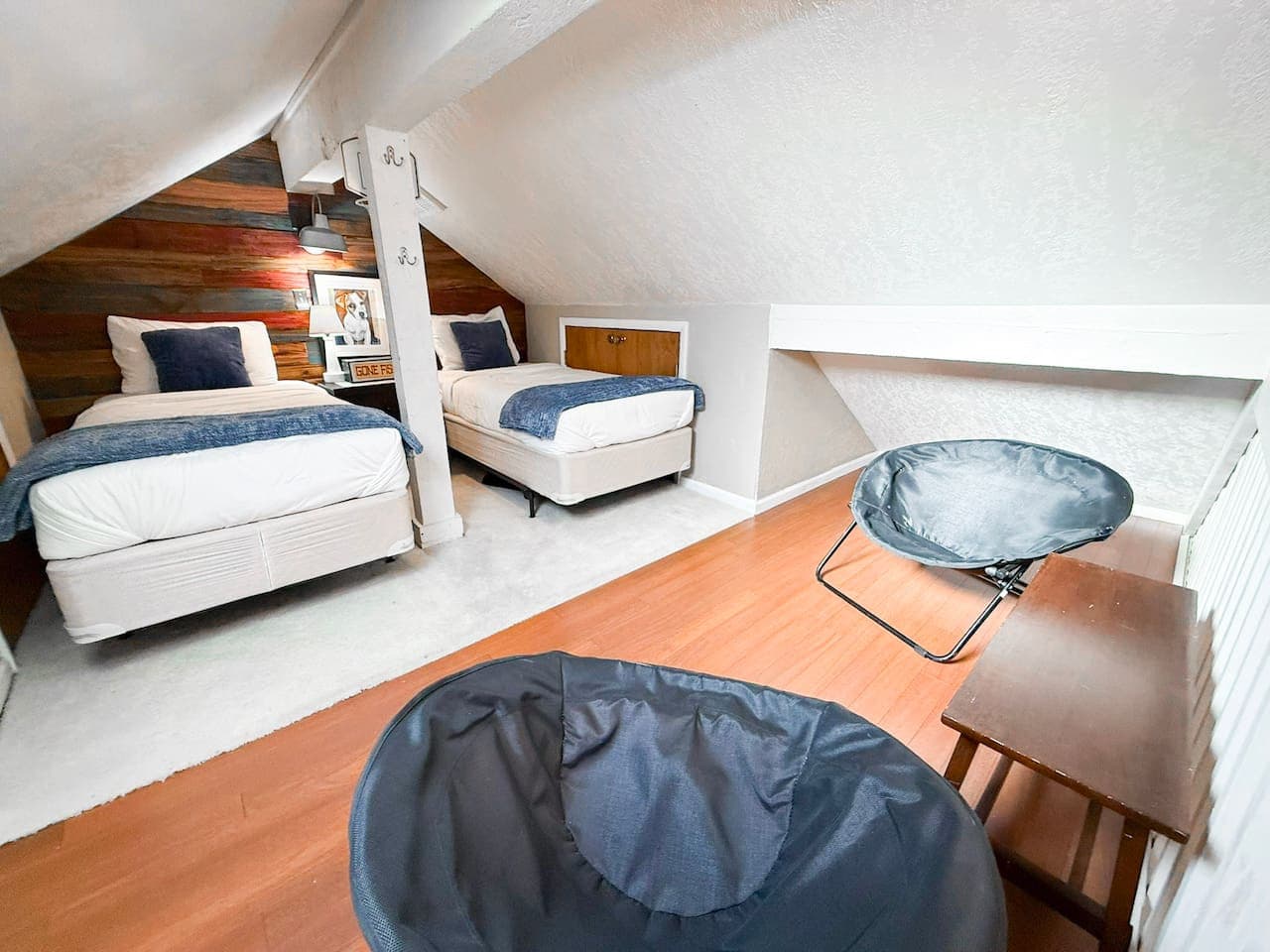 Charming loft hideaway offering twin beds and a cozy sitting area in a warm, rustic-modern setting.
Close to top attractions, it’s the perfect mix of comfort, style, and convenience.