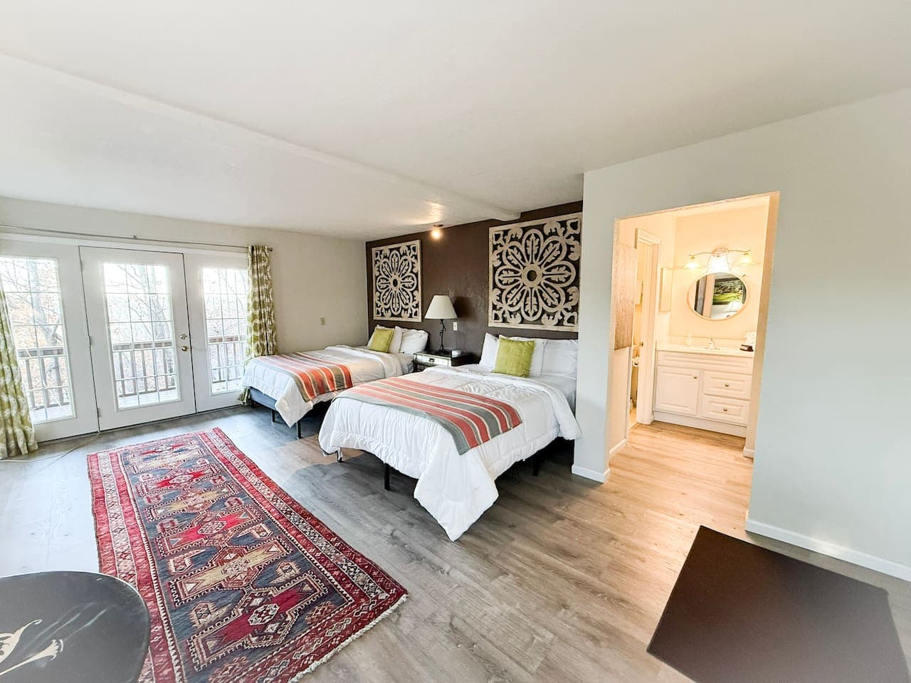 Sleep comfortably in a beautifully designed bedroom featuring cozy beds and calming décor.
A perfect Airbnb retreat for group getaways, lake trips, and weekend escapes.