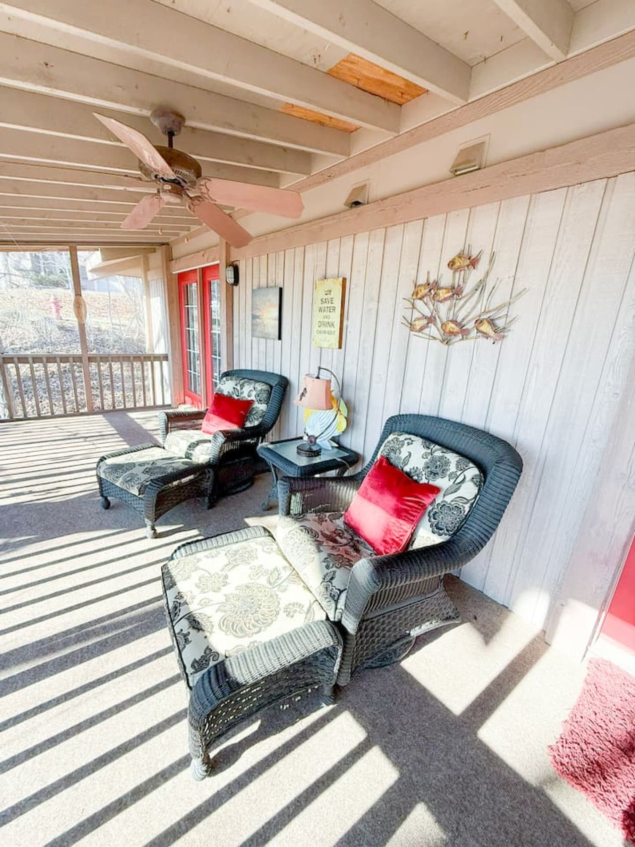 Relax on the private screened porch with cozy seating—perfect for morning coffee and peaceful evenings.