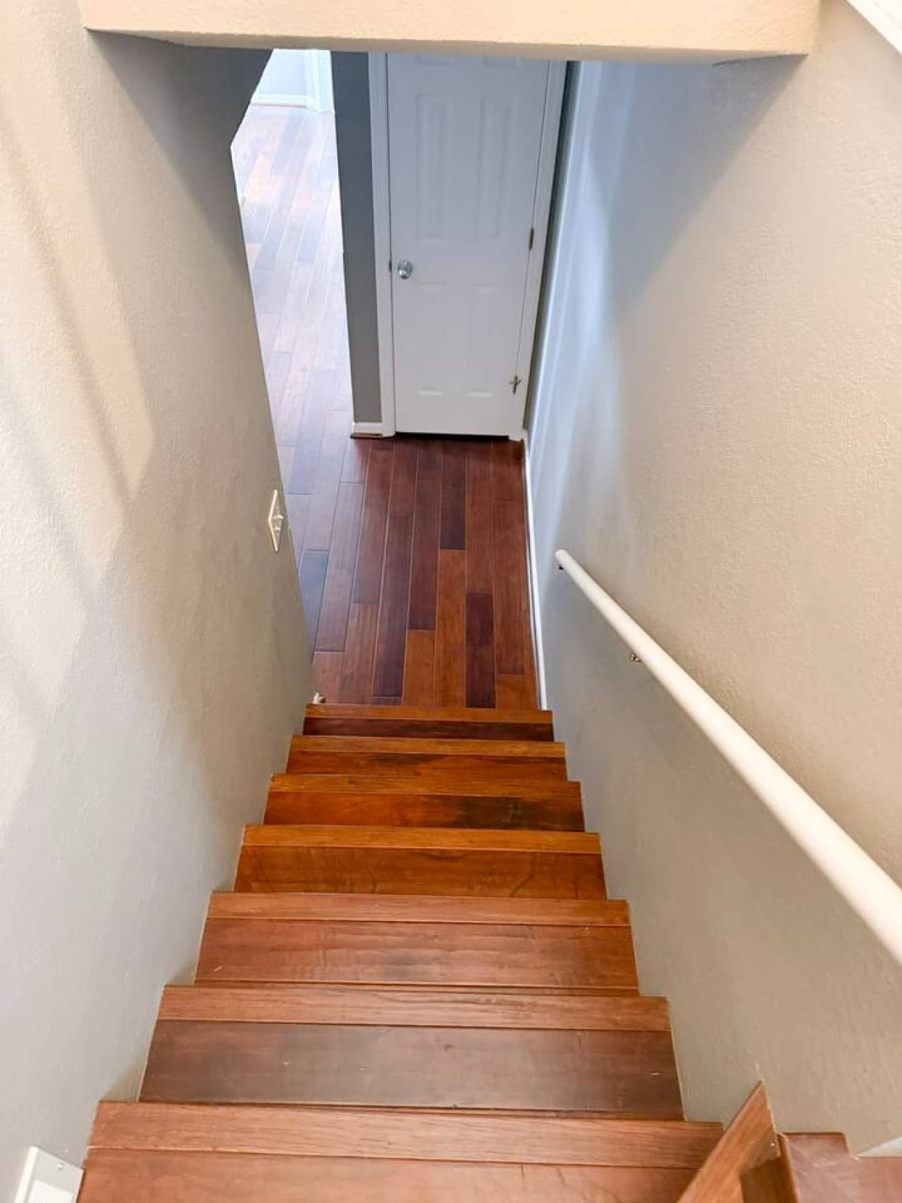 Wood-trimmed staircase leading to the main level.