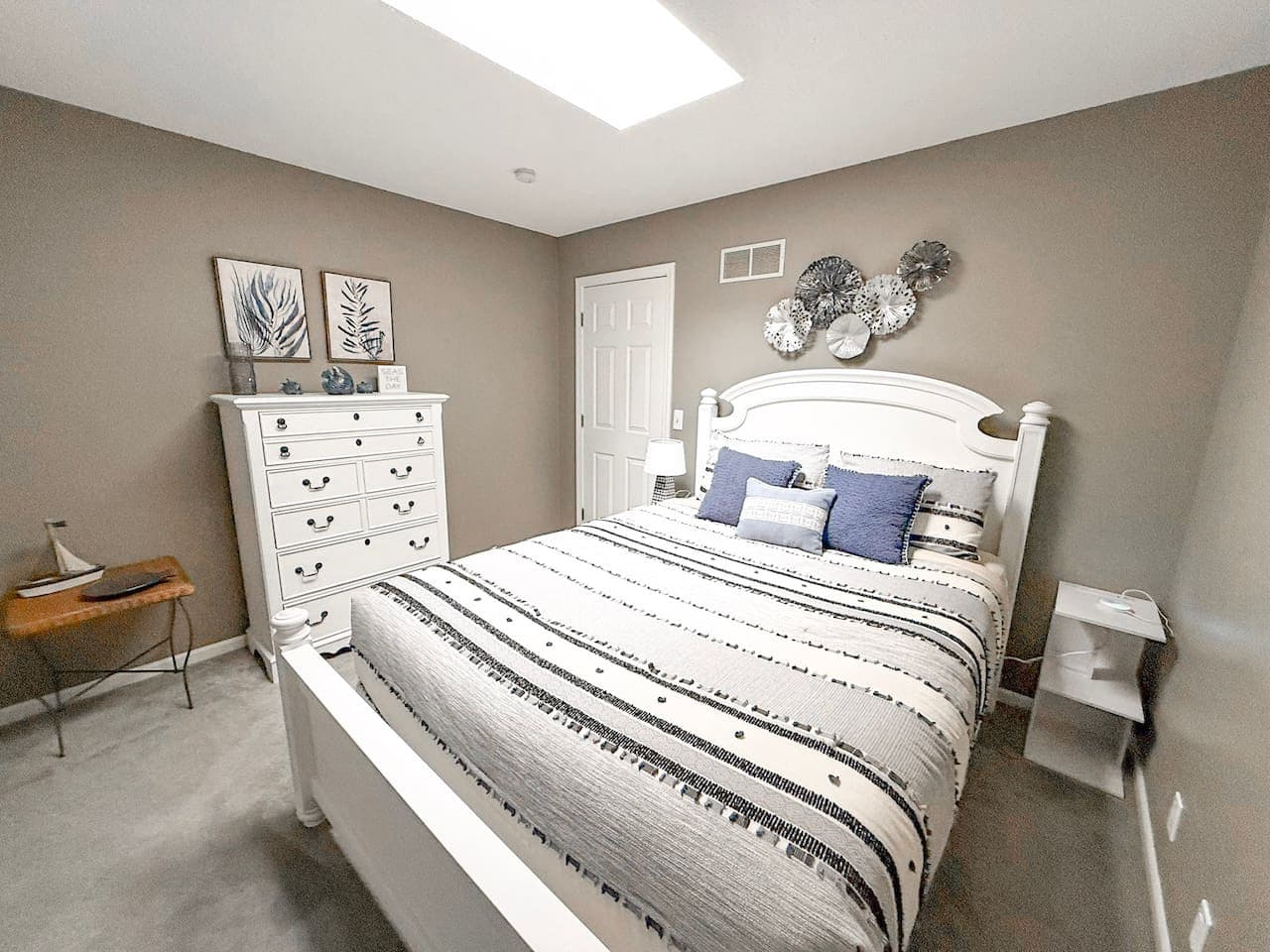 Comfortable guest bedroom with natural light.