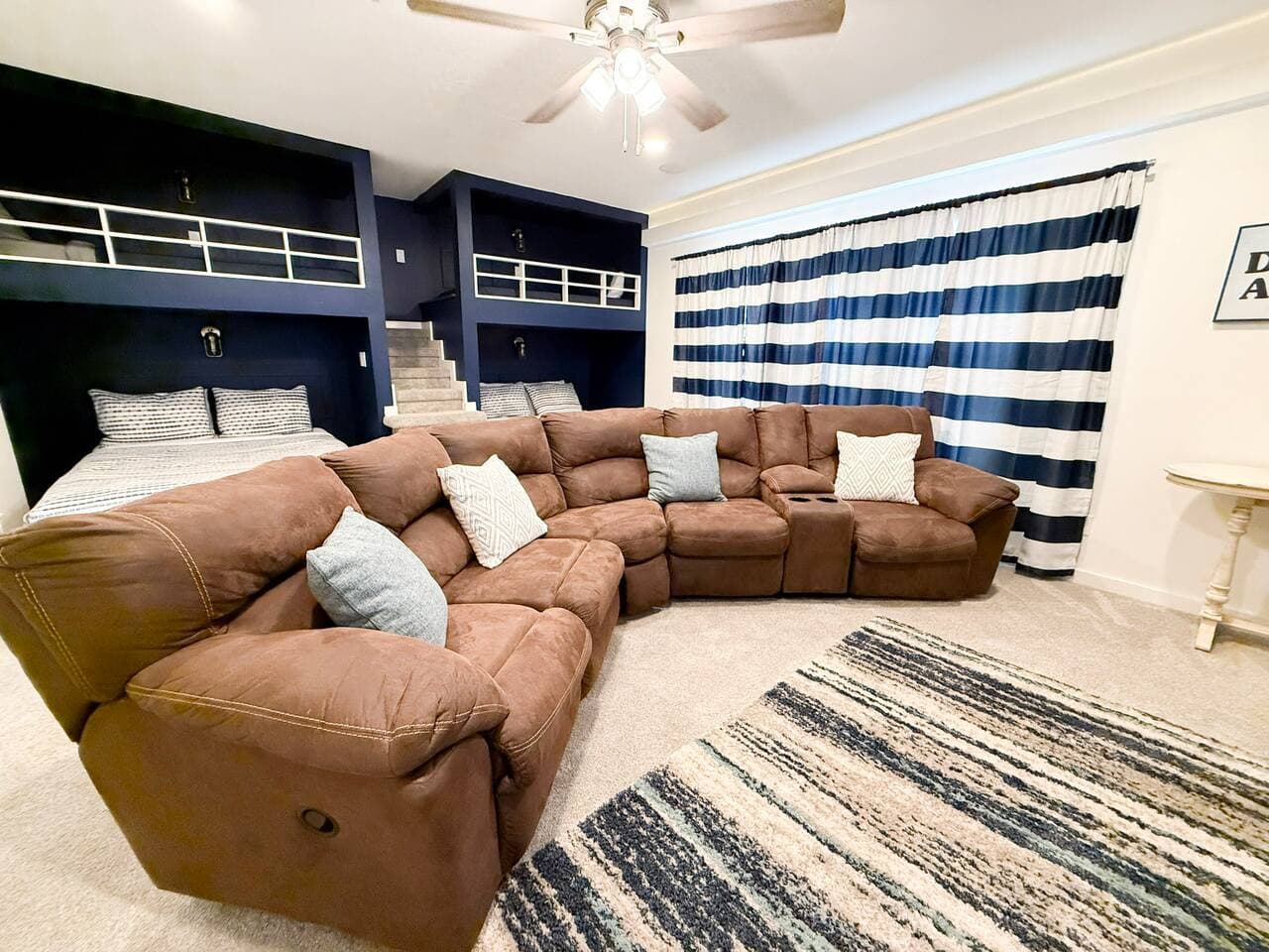 Cozy family room with large sectional and built-in bunk space.
