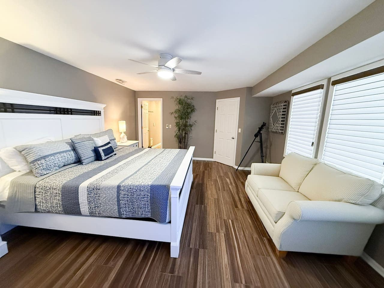 Inviting master suite with a sitting area and elegant decor.
