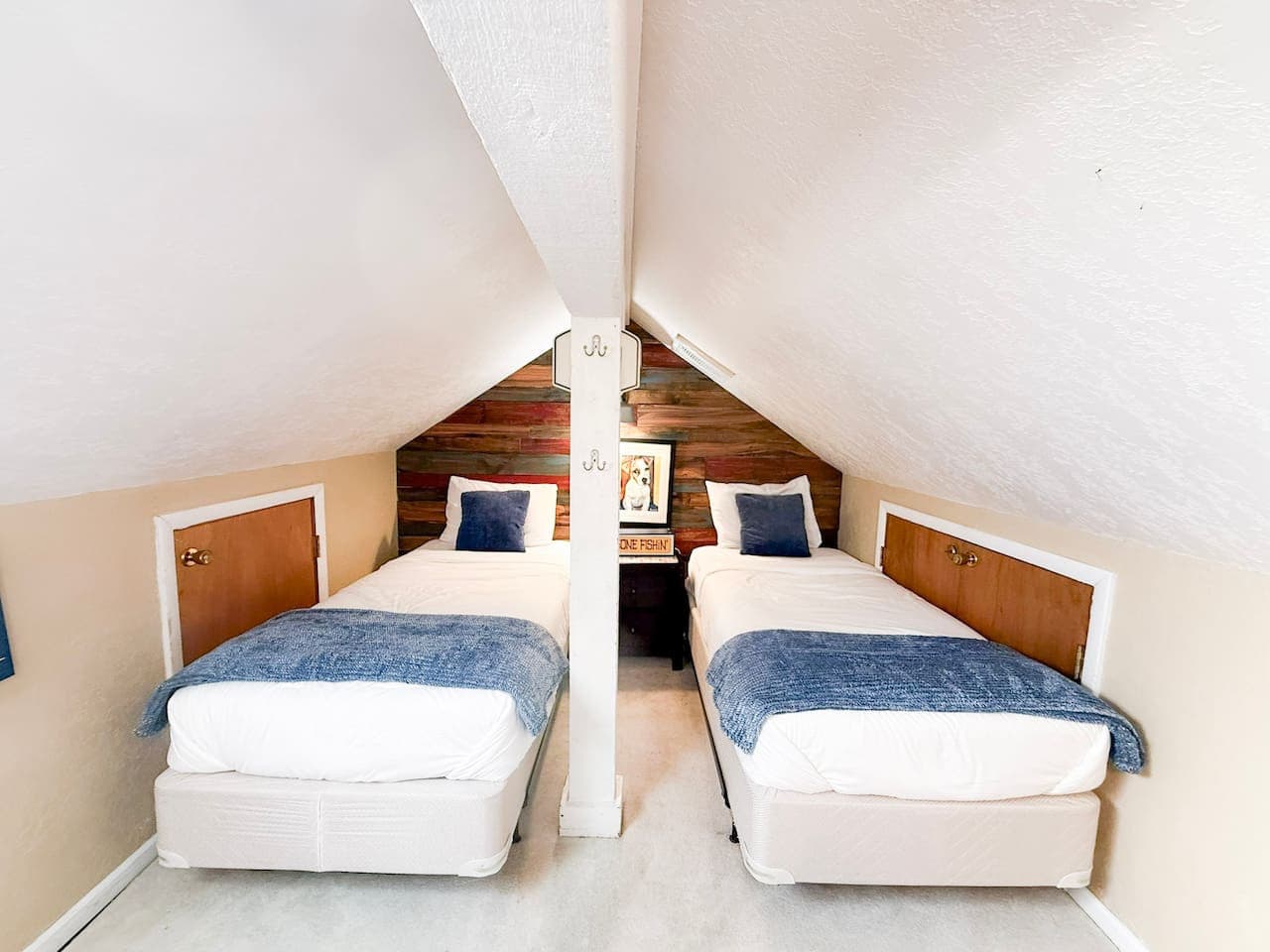 Cozy loft-style bedroom with twin beds—perfect for kids or extra guests seeking comfort and privacy.