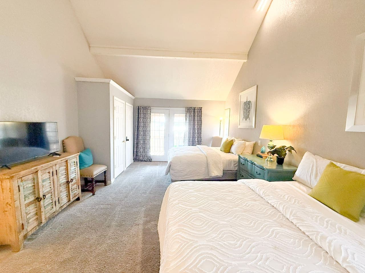 Relax in a spacious, sun-filled bedroom with comfortable beds and plenty of room to unwind.