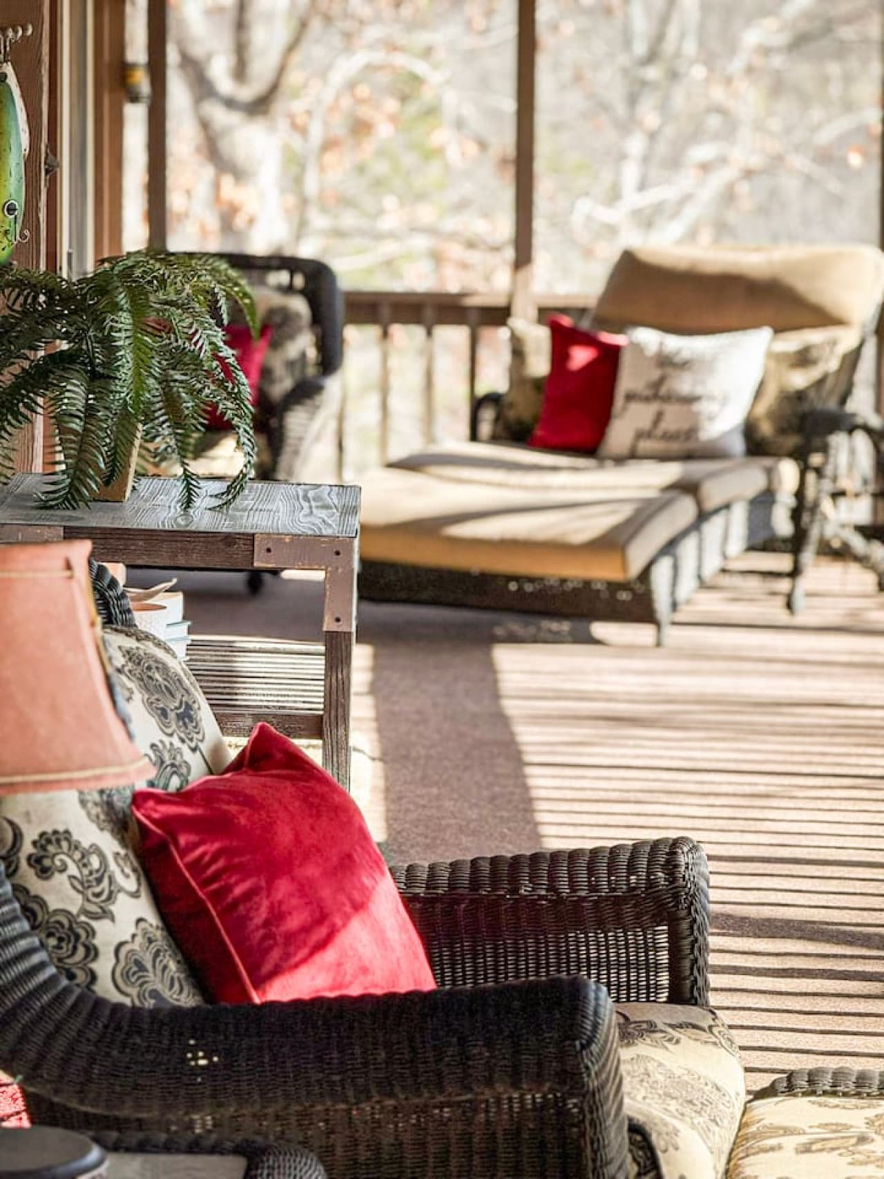 Unwind on the cozy screened-in porch with plush seating and peaceful nature views—perfect for morning coffee or sunset relaxation.