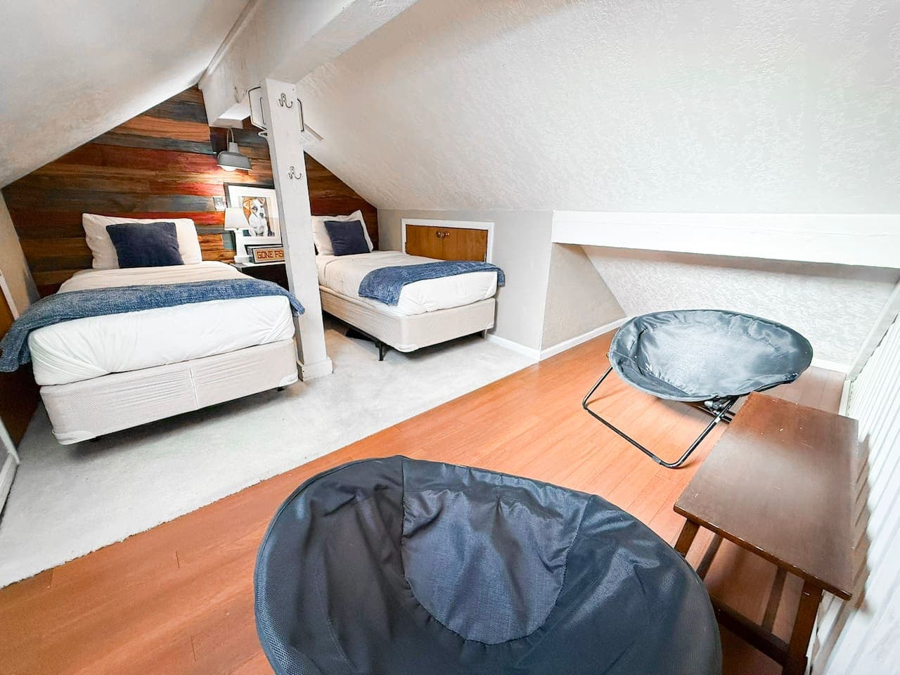 Cozy loft sleeping area with comfortable beds and a relaxed lounge vibe—perfect for kids or extra guests.