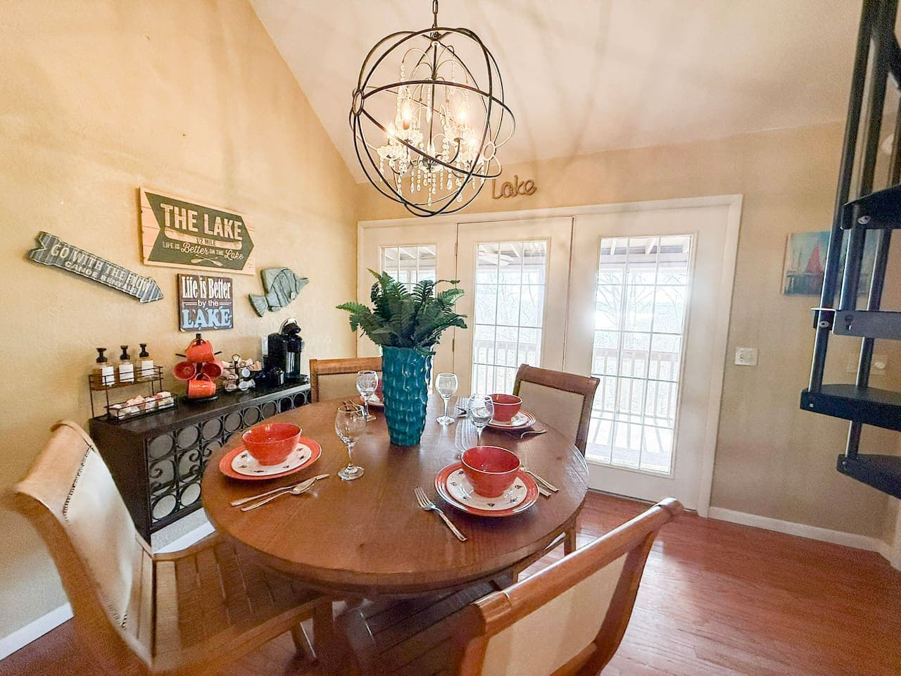 Start mornings and end evenings in a warm, inviting dining space with lake vibes.