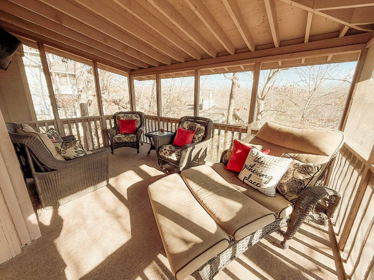 This inviting outdoor retreat offers comfy wicker furniture, refreshing breezes, and a serene nature backdrop. Ideal for guests seeking relaxation, fresh air, and cozy vacation vibes.