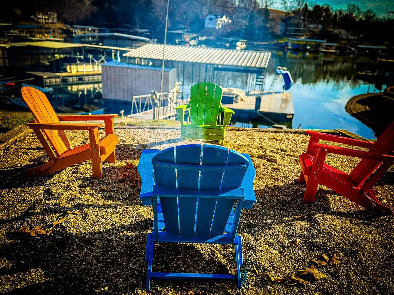 Relax lakeside in colorful Adirondack chairs overlooking the water, perfect for sunsets and fireside evenings.