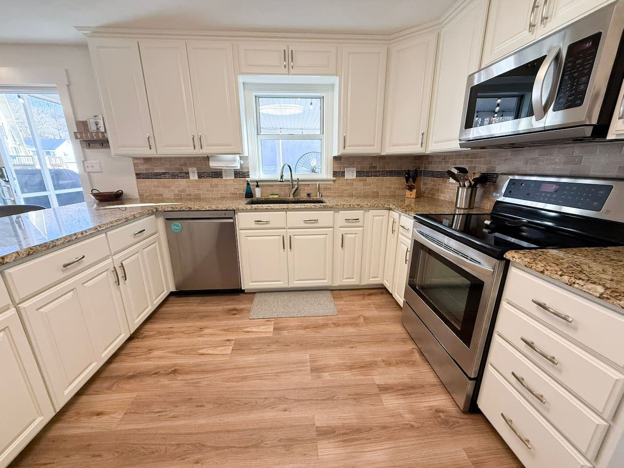 Cook and gather in this fully equipped modern kitchen with stainless steel appliances and spacious counters.