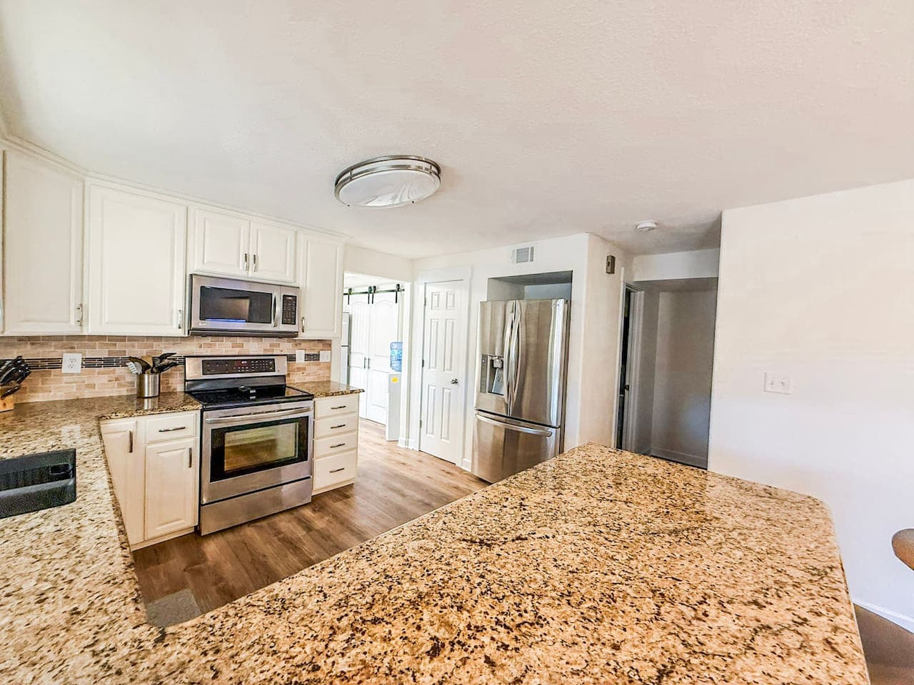 Cook, gather, and entertain in this bright, fully equipped kitchen with granite countertops and modern appliances.
Perfect for family meals and extended stays, this Airbnb offers a spacious, open kitchen designed for comfort and convenience.