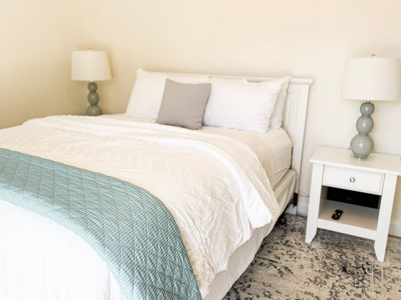 Drift off in this bright, cozy bedroom with plush bedding and a calming design, perfect after a day on the lake.