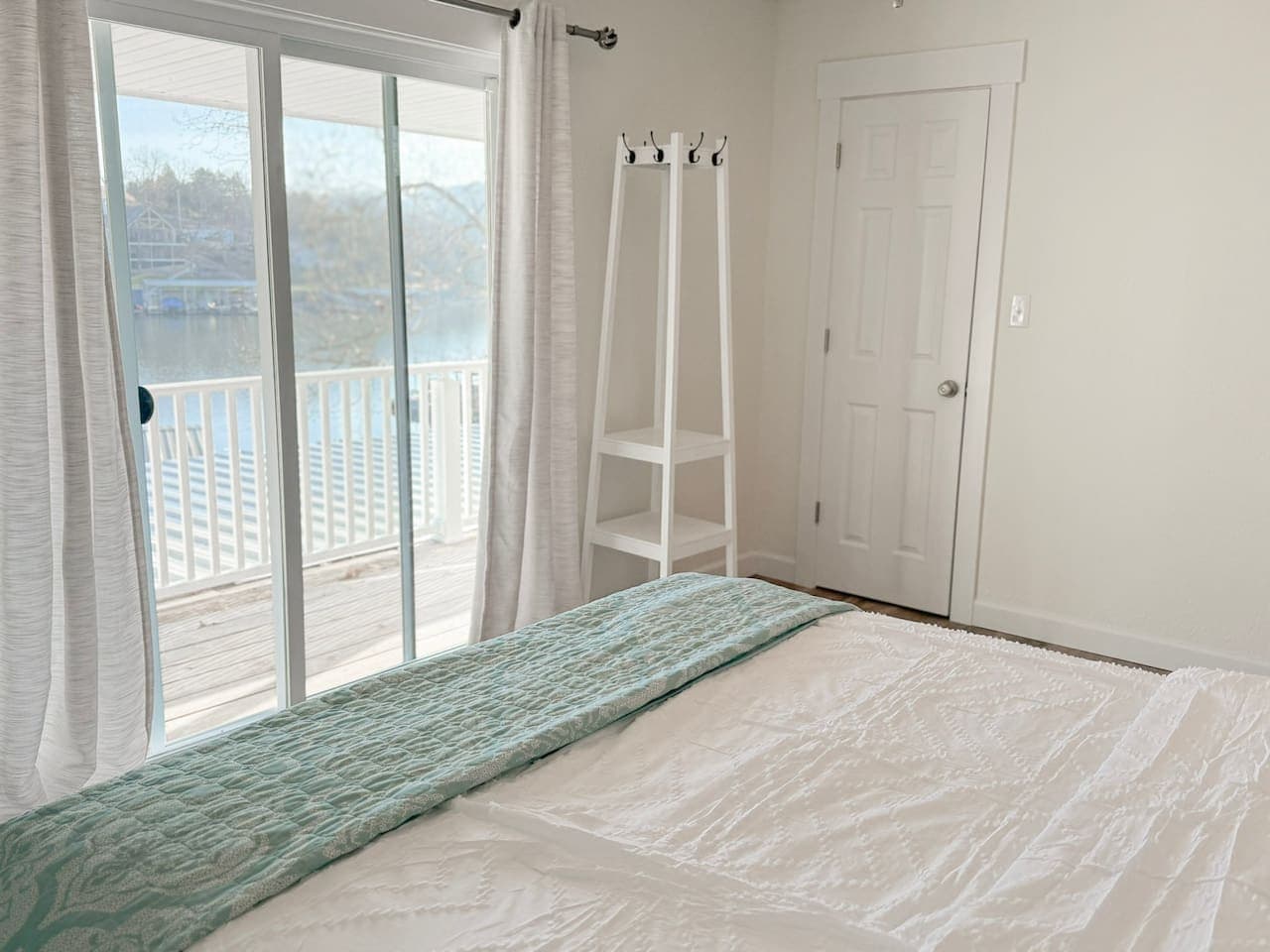 Wake up in a bright, serene bedroom with a comfortable king bed and direct access to the lakefront deck.
Perfect for romantic getaways and relaxing lake vacations, this peaceful retreat offers natural light, scenic views, and restful comfort.