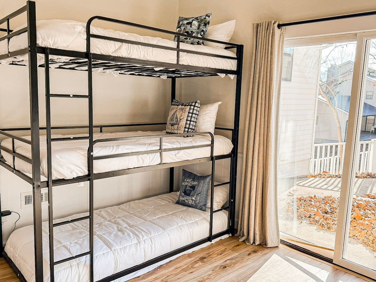 Sleep comfortably in this triple bunk bed room, perfect for kids, families, and group stays.
