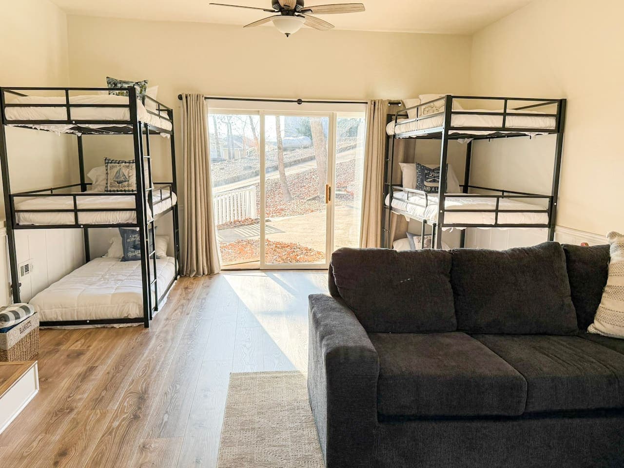 Sleep comfortably in this bright bunk room with queen-size beds and natural light, perfect for families and groups.