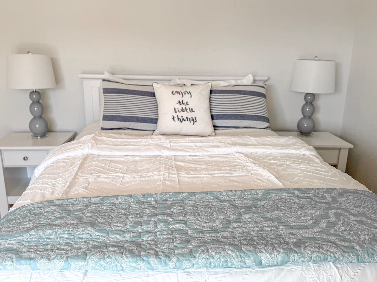 Rest easy in this serene bedroom featuring a plush king bed with cozy linens for ultimate comfort.