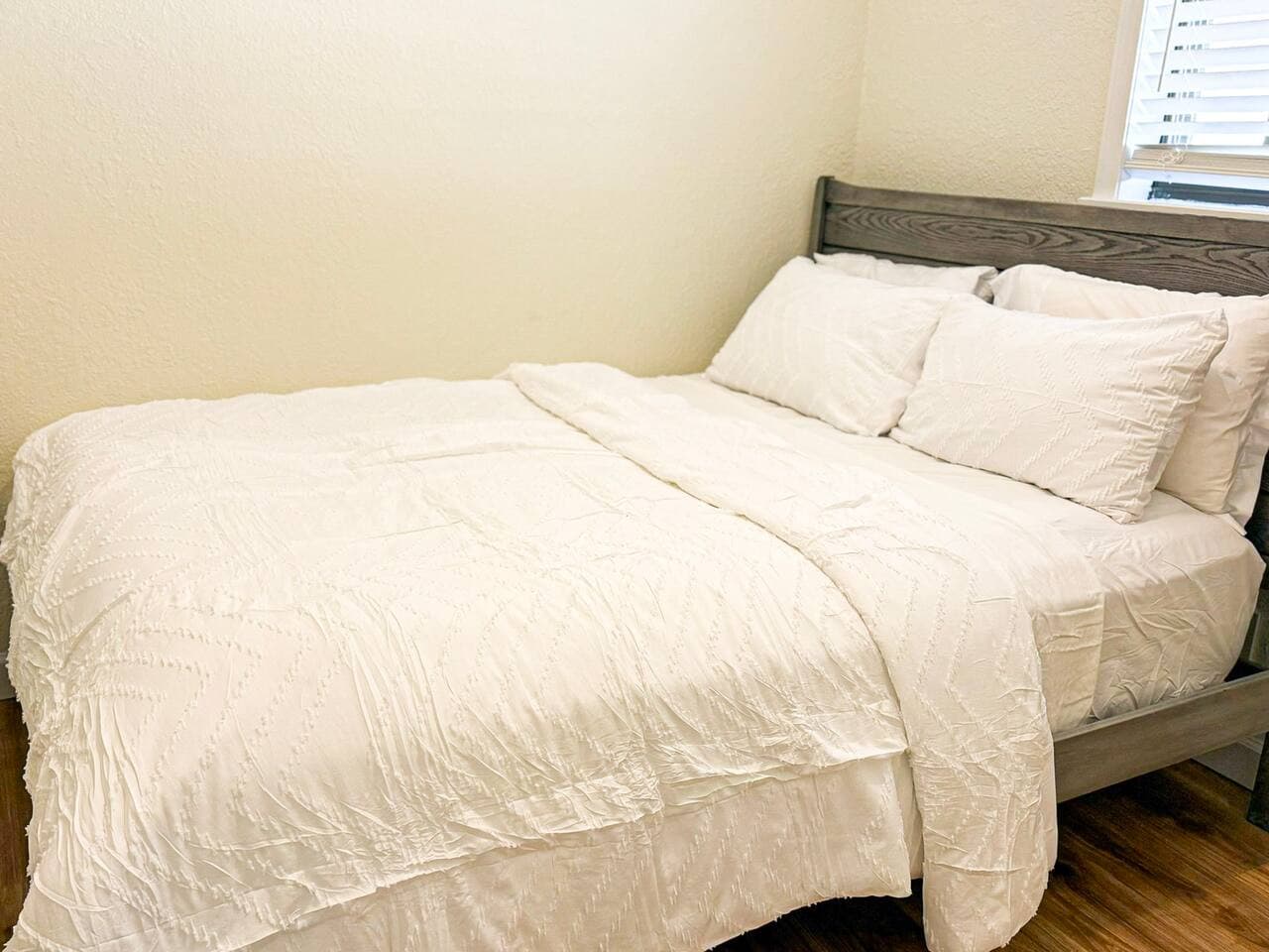 Relax in this cozy, well-appointed bedroom with a comfortable queen bed, crisp linens, and a calm, restful vibe.