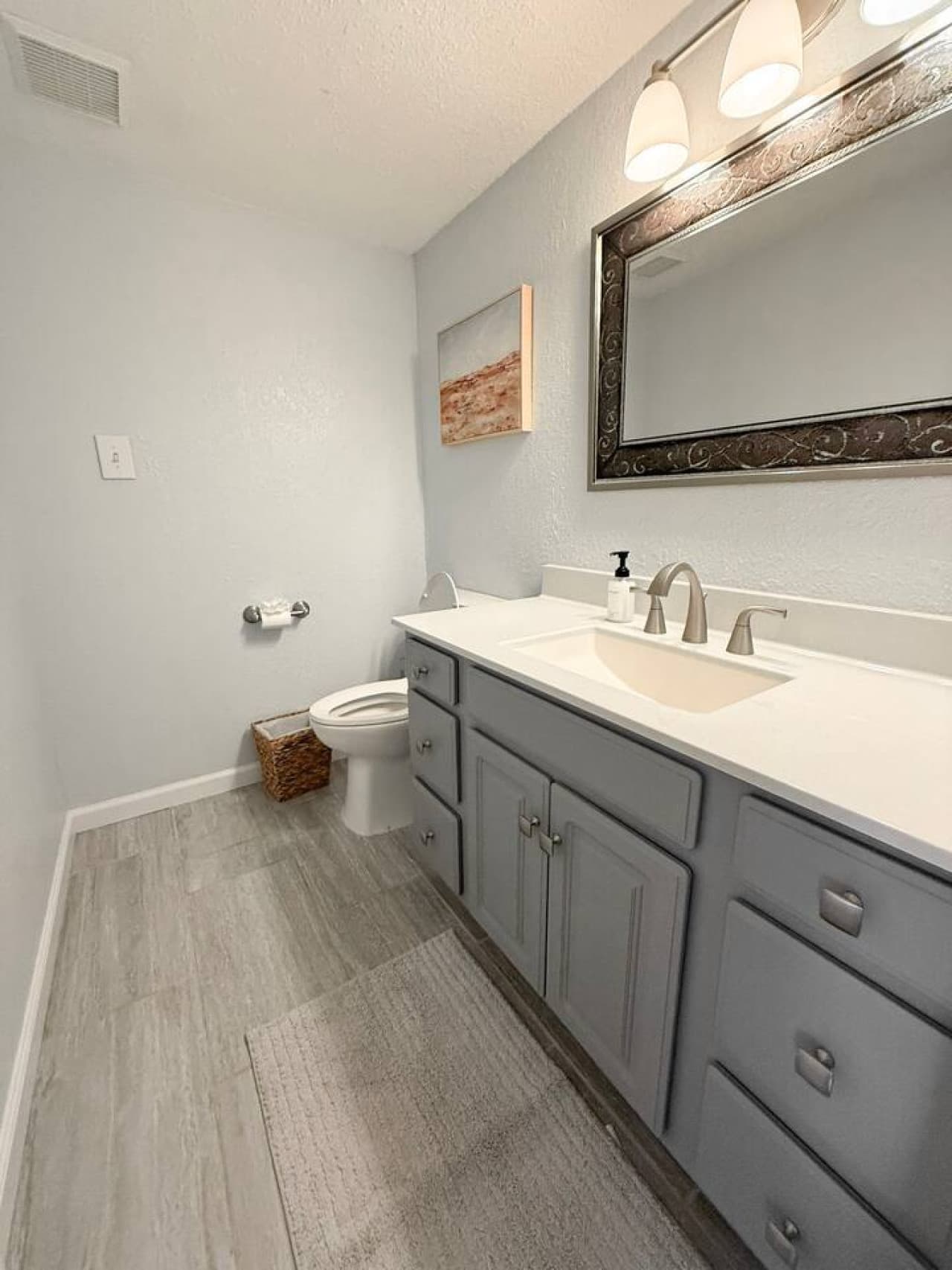 Refresh and unwind in this clean, modern bathroom with stylish finishes and ample counter space.