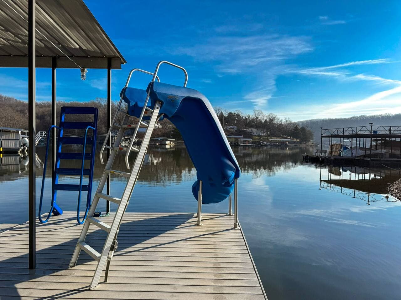 Dive into fun at this lakefront Airbnb with a private dock and waterslide, perfect for summer adventures and family memories.