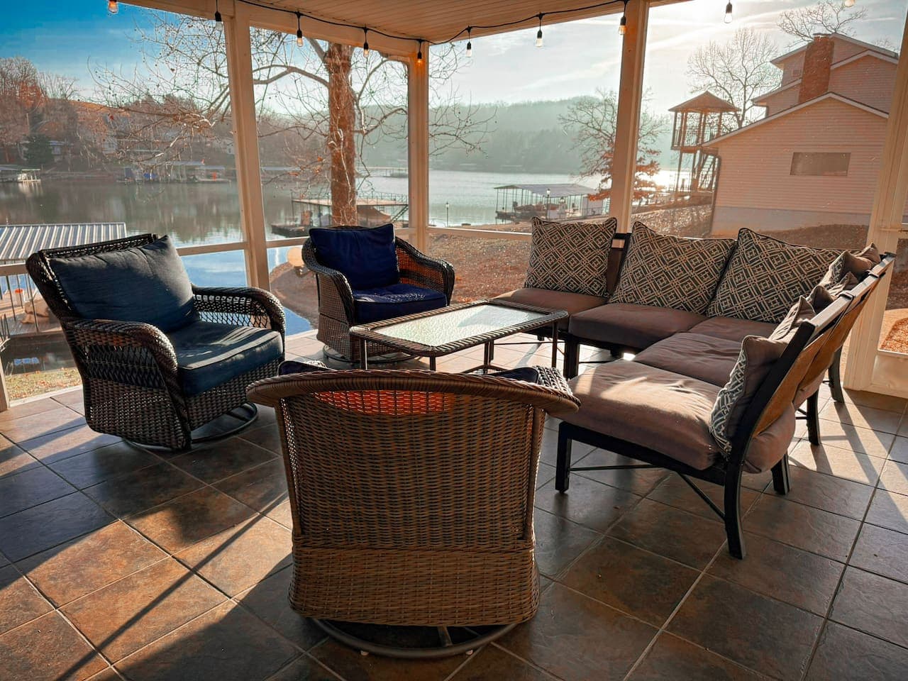 Relax and entertain in this covered lakeview lounge, perfect for morning coffee, sunset drinks, and outdoor living.