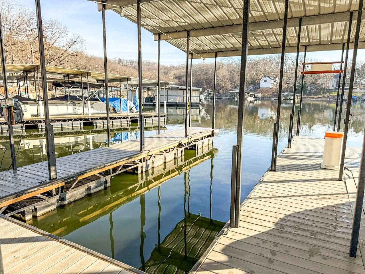Step out to a private covered dock with calm lake access, perfect for boating, fishing, and sunrise views.
Ideal for lakefront vacations and outdoor adventures, this waterfront Airbnb delivers convenience, scenery, and true lakeside living.