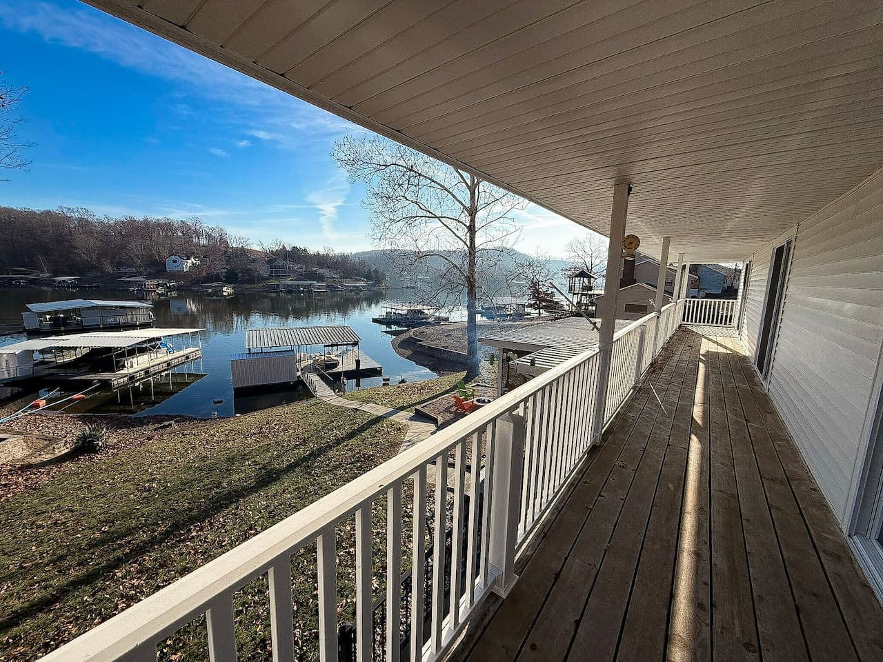 Step out onto the spacious covered lakefront deck and take in peaceful water views and fresh lake air.