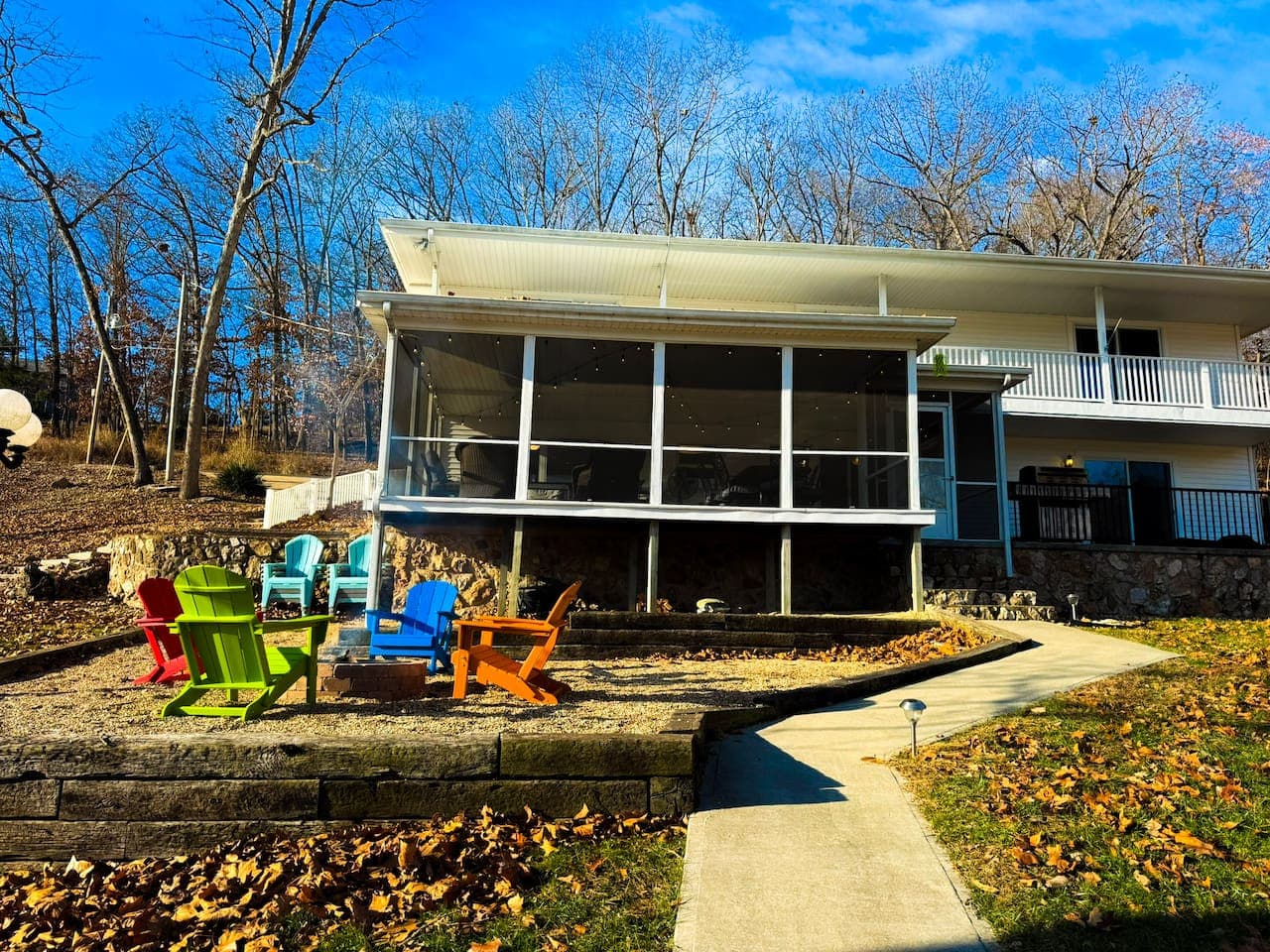 Relax at this charming lakefront home with spacious decks and outdoor seating, perfect for soaking in peaceful water views.