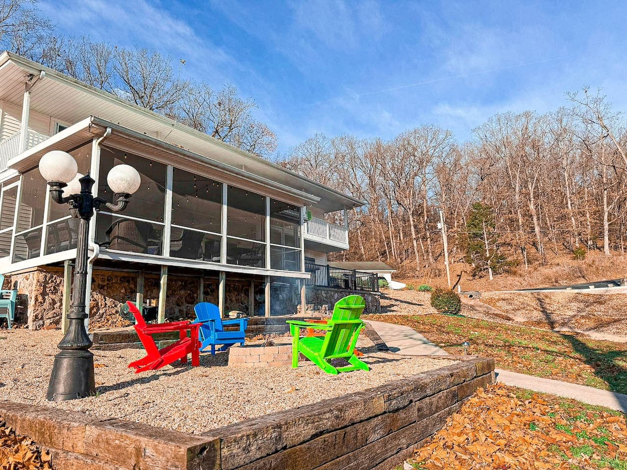 Relax at this lakefront Airbnb with a screened-in porch and fire pit, perfect for enjoying fresh air and water views year-round.