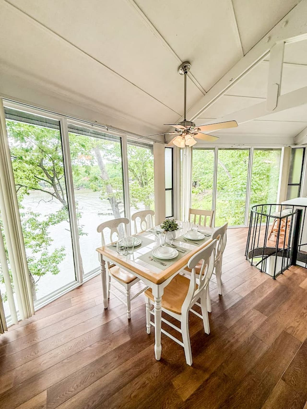 Enjoy meals with a forested backdrop in this cozy dining space nestled among the trees.