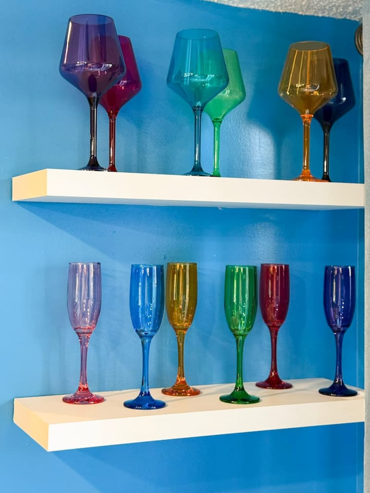Colorful glassware display, adding a playful and elegant touch to the decor.