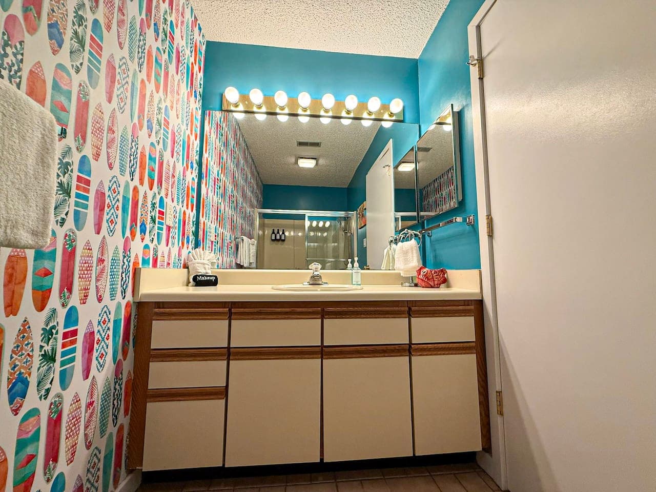 Spacious vanity with ample lighting and storage.