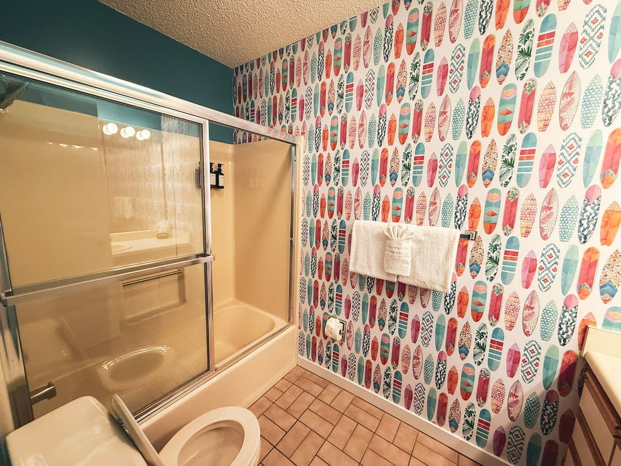 Bright and playful bathroom with a walk-in shower.