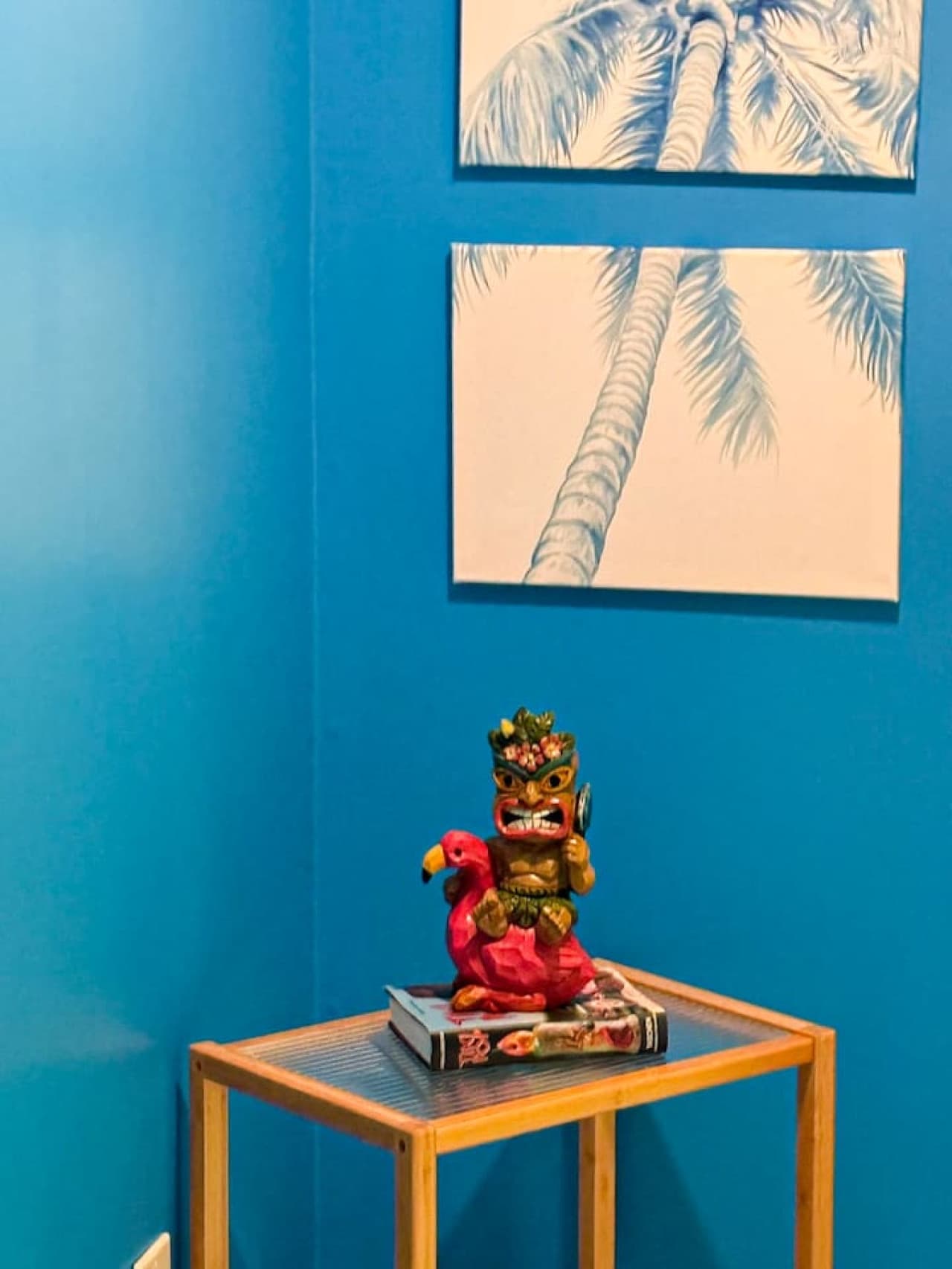 Unique tiki decor and serene palm art for a relaxed vibe.