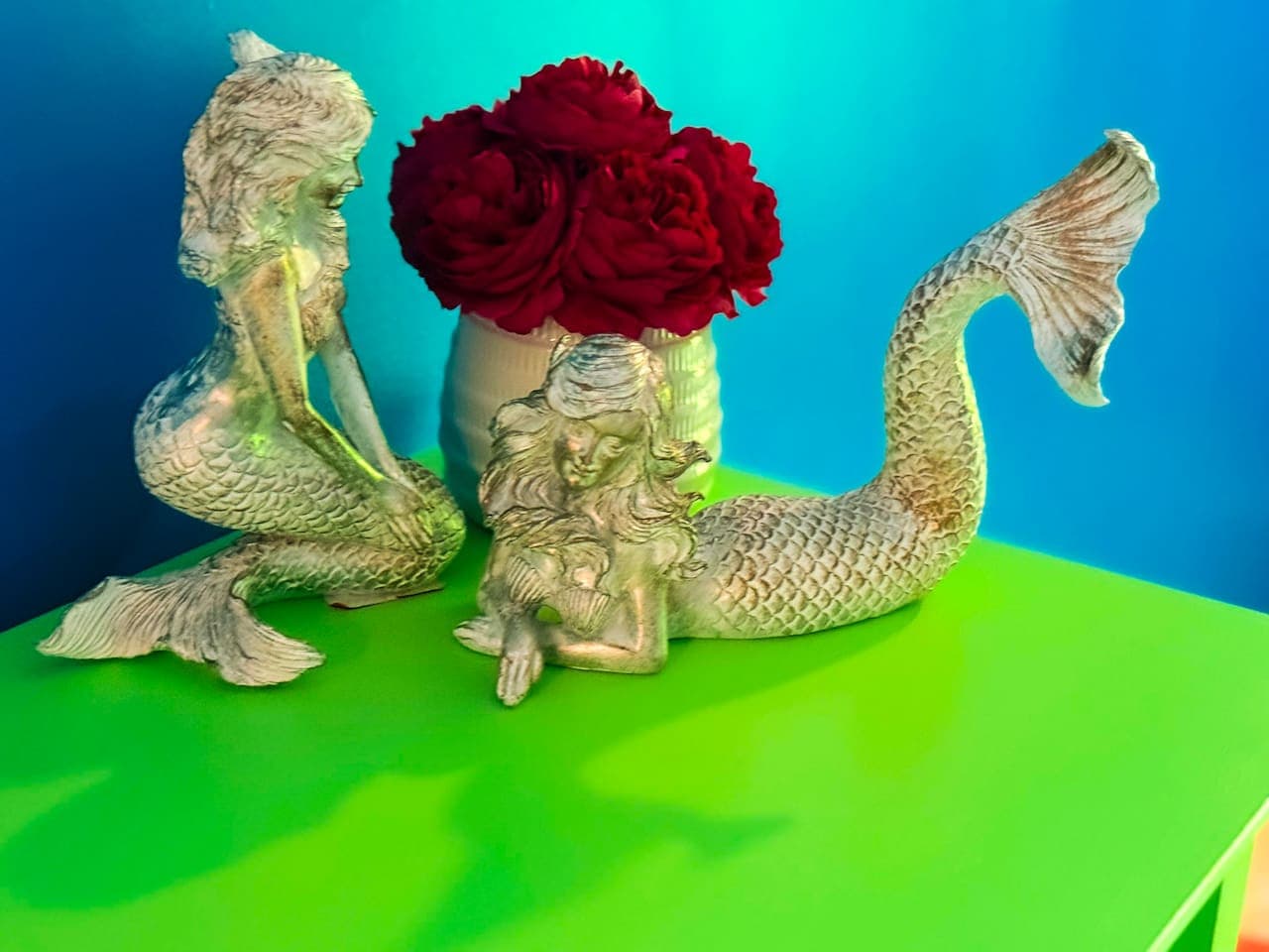 Whimsical details like these mermaid statues add unique charm.