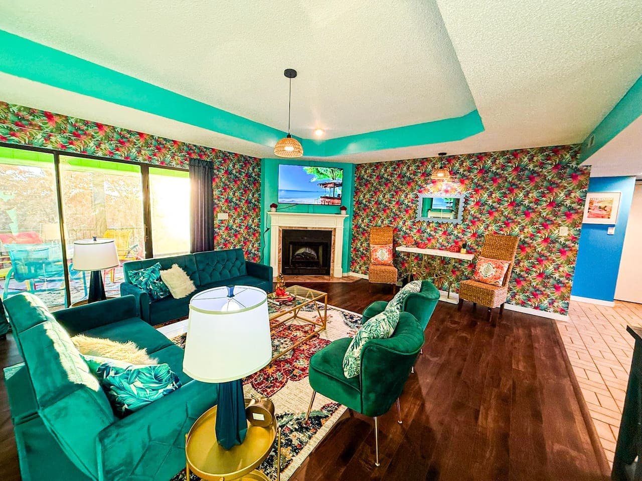 Inviting living space with bold wallpaper and ample seating.