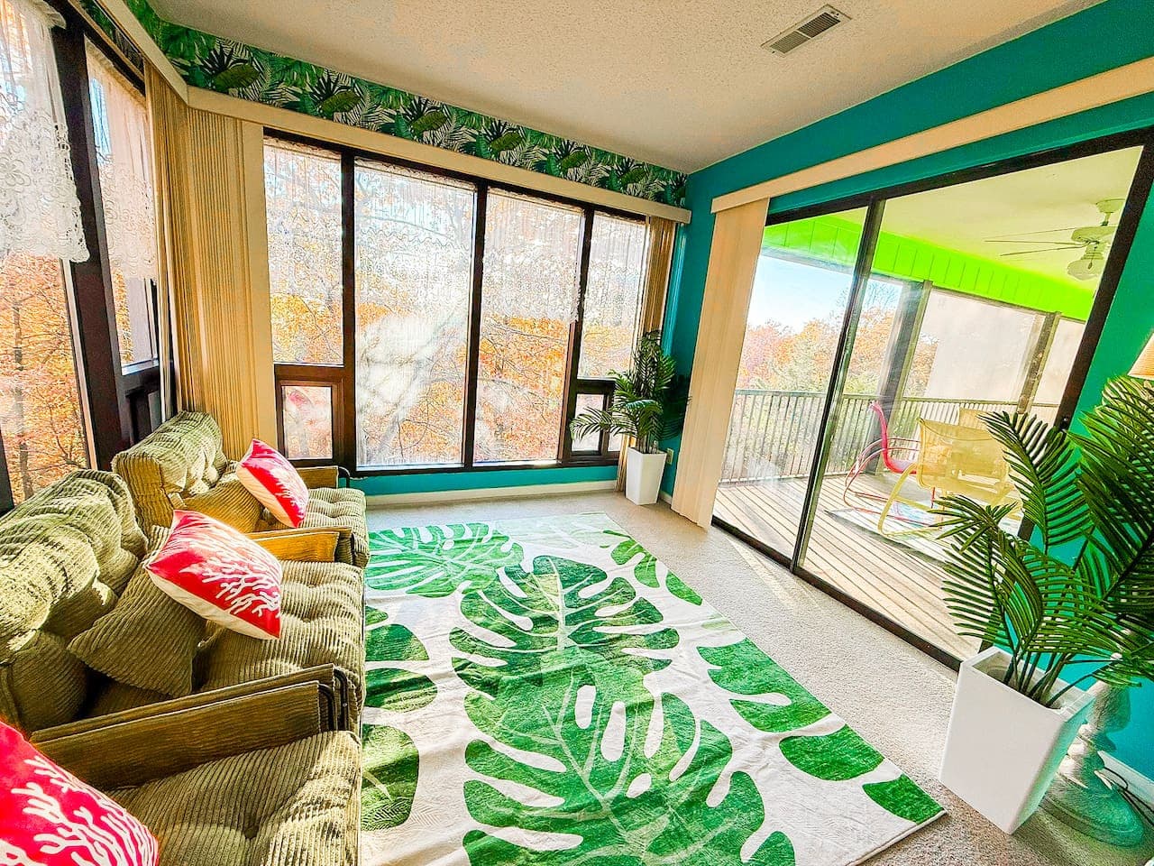 Light-filled sunroom leading to the private balcony.