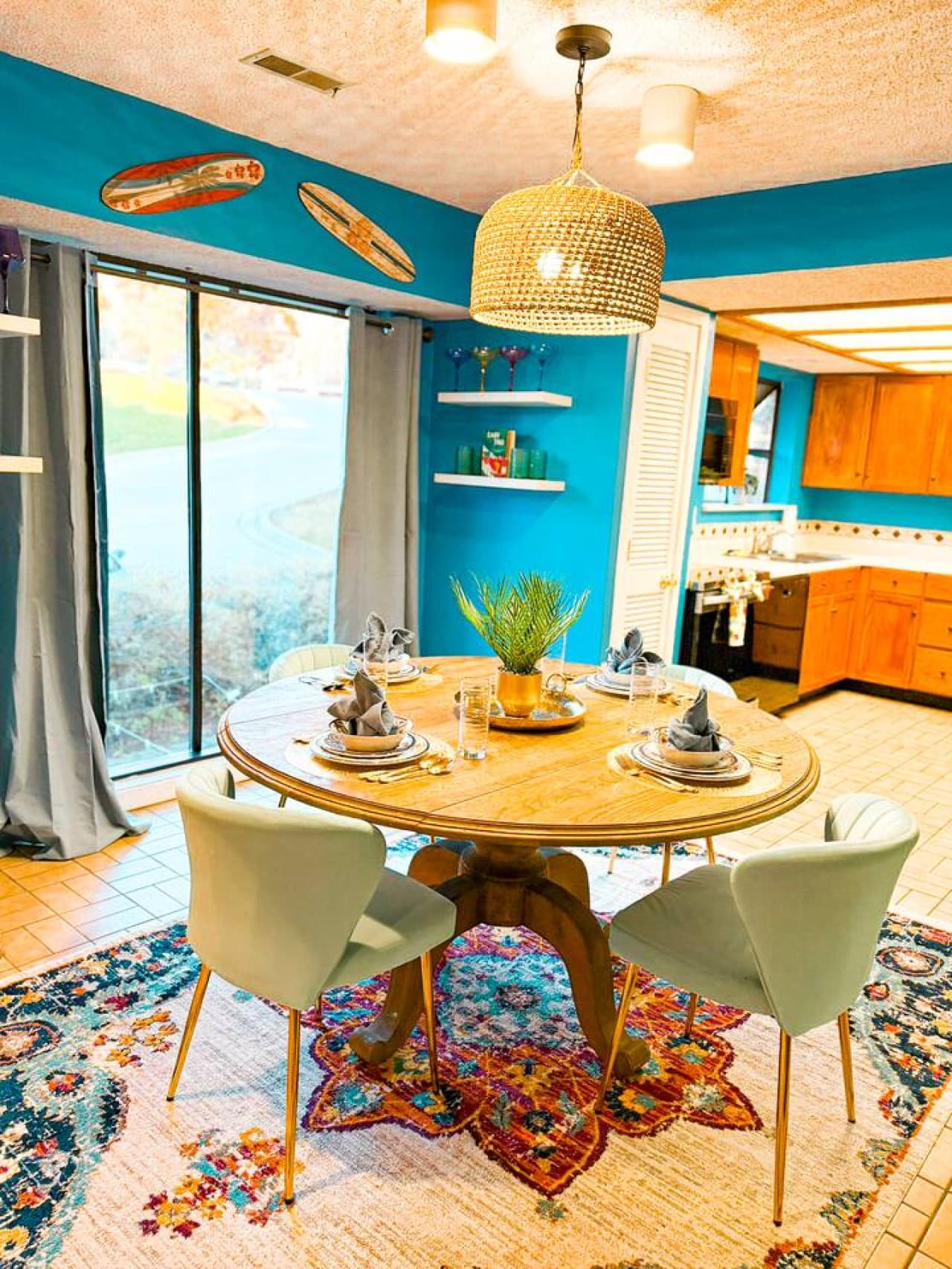 Stylish round dining table opening directly to the kitchen.