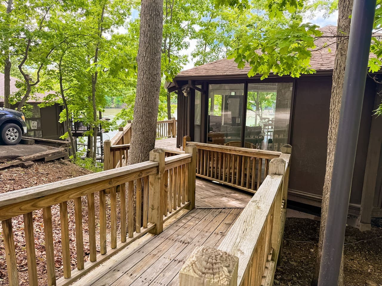Welcoming entrance to your Lakefront Treetop Village getaway, showcasing the convenient ramp access amidst the natural setting.