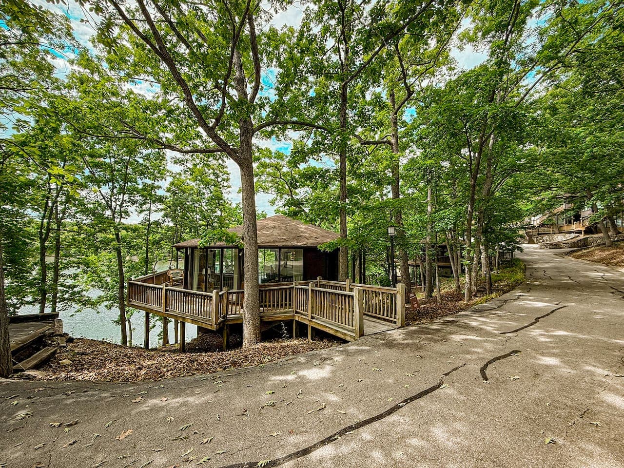 The unique "treetop" design at Lakefront Treetop Village, perfectly integrated into the lush landscape with stunning lake views.